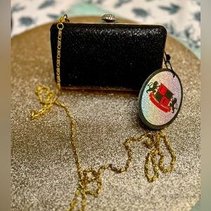 Brand new never used black with shimmer faux snake skin purse/clutch